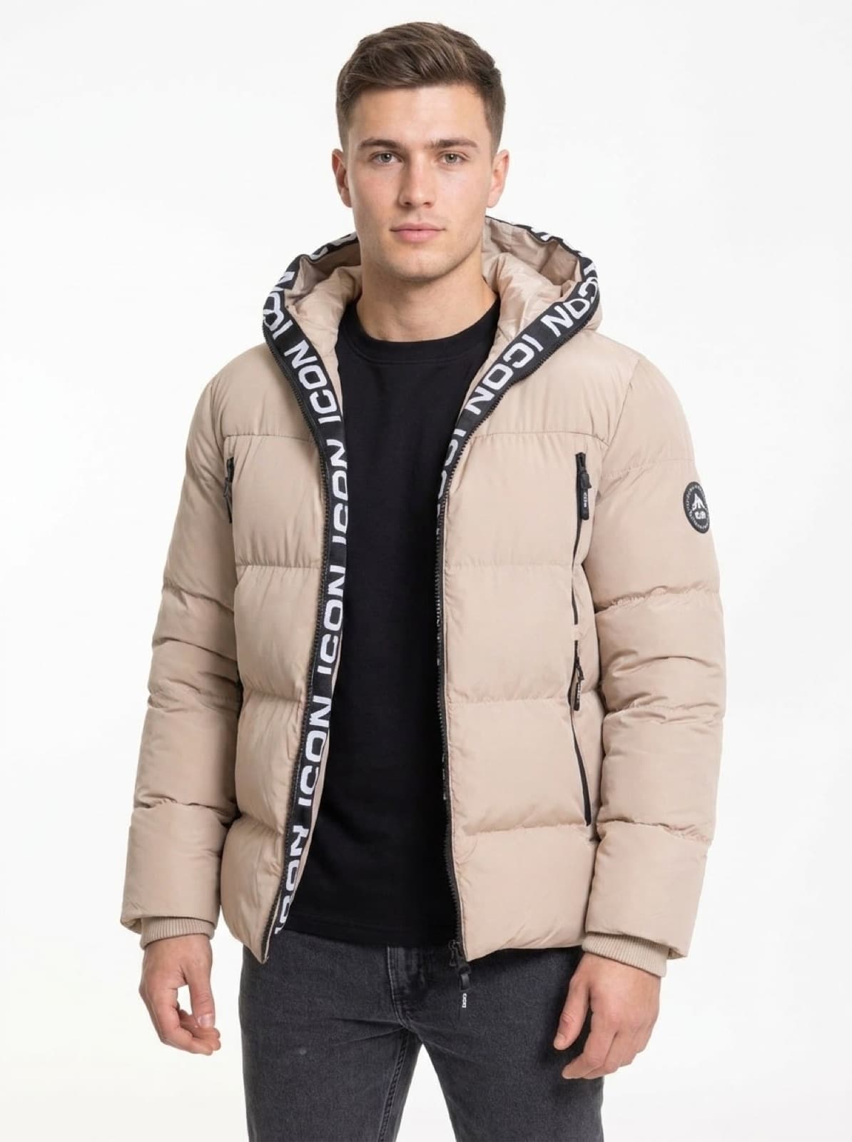 Model in a beige hooded puffer jacket
